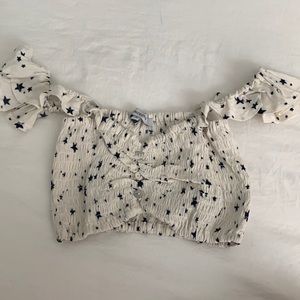 White cropped off the shoulder top with stars and buttons